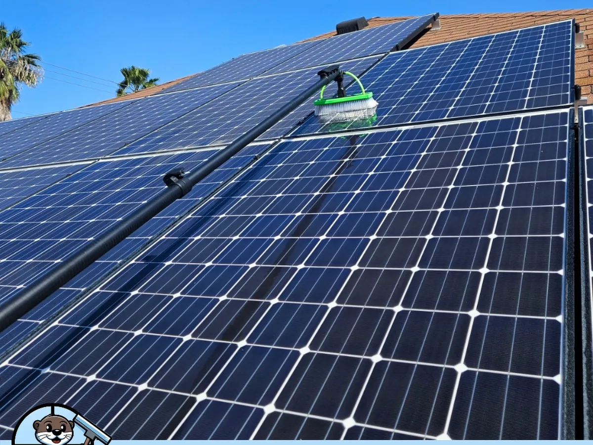 Close-up of Otto's technician scrubbing rooftop solar panels in Laredo